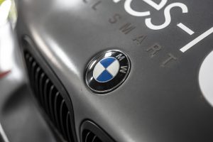 Close-up of the BMW badge on a grey bonnet