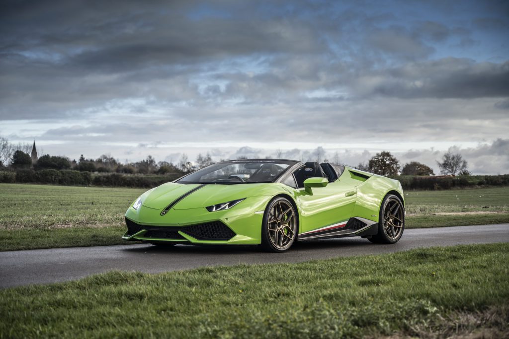 Green Lamborghini stationary on a racetrack