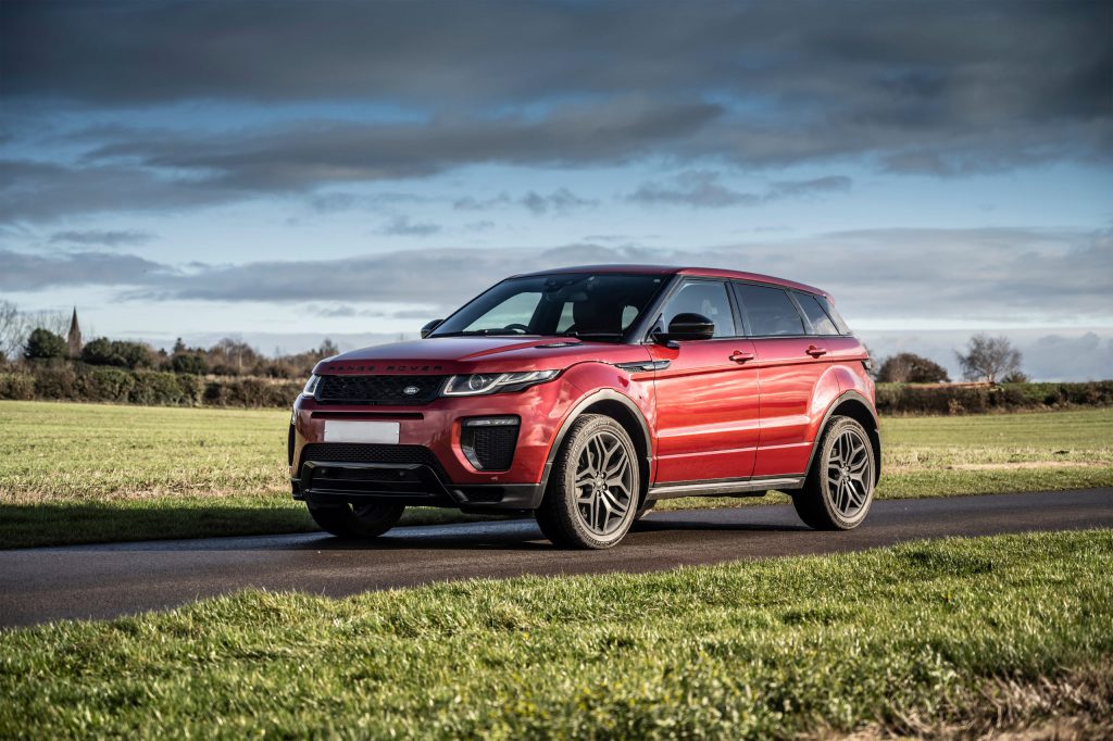 Red Range Rover stationary on a racetrack